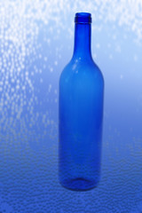 Glass Bottle on Textured Background