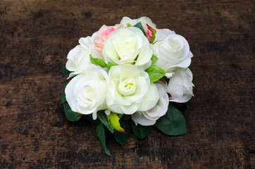Beautiful pink and white roses isolated on wood