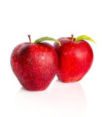 Fresh two red apples isolated on white background.