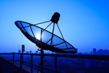 Satellite Dish on the Roof at Sunrise.