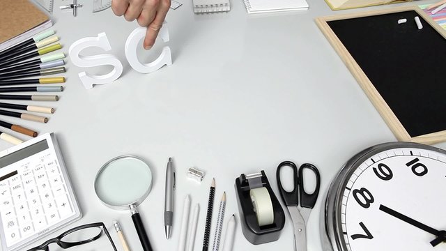 school time, hand write text on the desk full of stationery