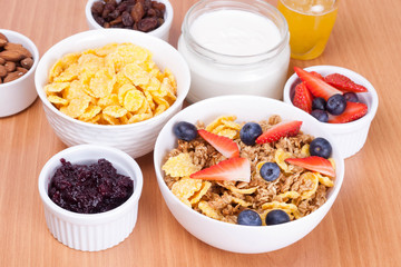 bowl of cornflakes with fresh berries and breakfast cereals