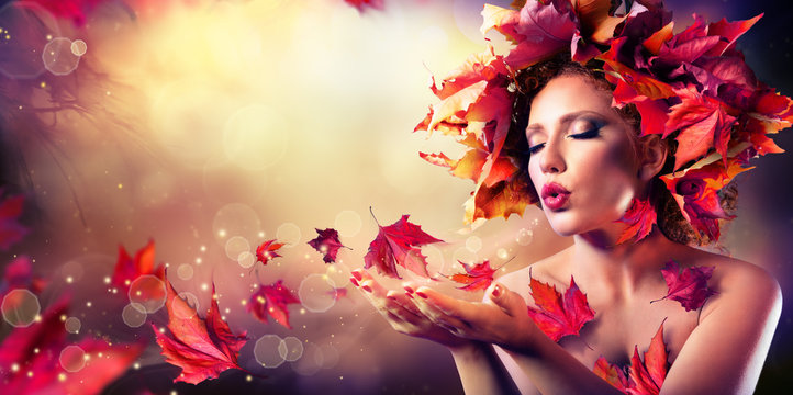 Autumn woman blowing red leaves - Beauty Fashion Model Girl

