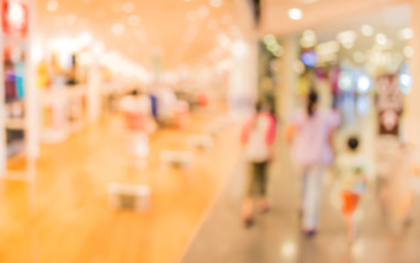 blurred image of shopping mall and people