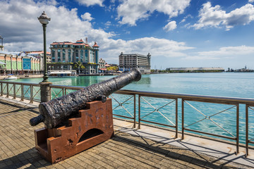 Old cannon on the promenade at Caudan Waterfront, Port Louis, Ma - obrazy, fototapety, plakaty