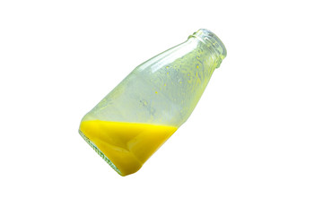 Fresh pumpkin juice in glass bottle on background