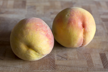  peaches on wood background