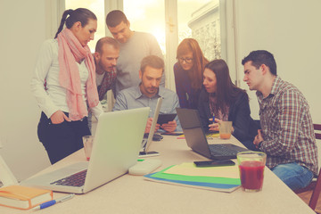 Young group of people discussing business plans.