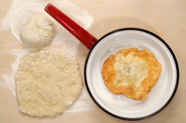 home made hungarian langos in a pan