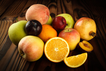 Assortment of exotic fruits on the wooden table