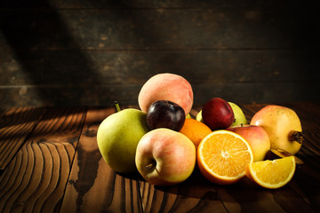 Assortment of exotic fruits on the wooden table