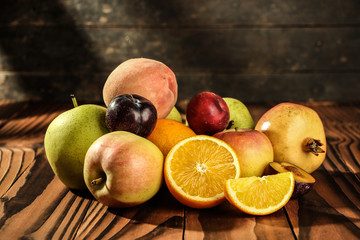 Assortment of exotic fruits on the wooden table