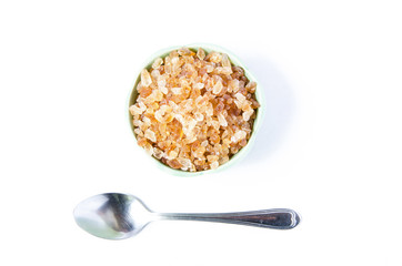 Rock sugar in bowl with spoon