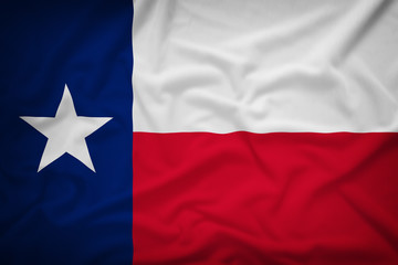 Fototapeta na wymiar Texas flag on the fabric texture background,Vintage style