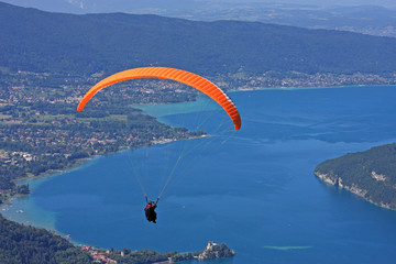 Paraglider above Lake Annecy - obrazy, fototapety, plakaty