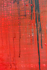 red painted canvas background with paint leak drips