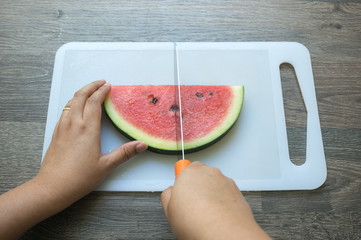 Cutting a watermelon
