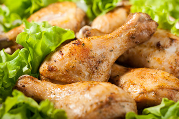 Baked chicken legs on plate