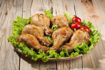 Baked chicken legs on plate