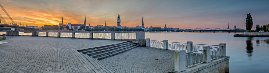 Panoramic view on old Riga city from left embankment of the Daugava river, Latvia - obrazy, fototapety, plakaty