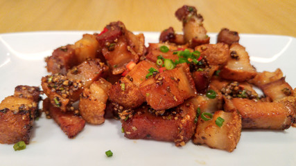 Plate of Deep Fried Crispy Pork Belly Cooked with Garlic and Pepper Sauce
