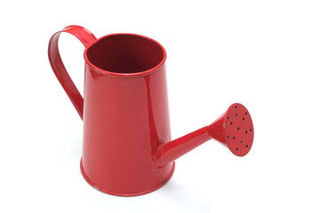 Red watering can isolated on white background