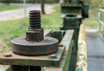 Old big screw and nut - part of the lock mechanism of dam - close-up