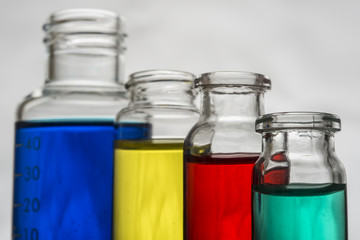 Set of laboratory bottles with color liquid