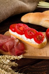 Fresh baguette with cottage cheese and tomatoes
