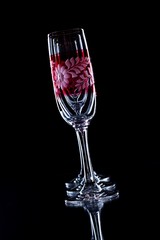 Three color glasses in a row on black background