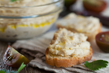 Delicious snack from crostini with chicken pate or paste and tomatoes, selective focus