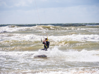 Wakeboarder making tricks on waves