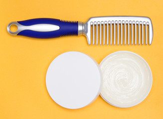 Hair wax with a comb