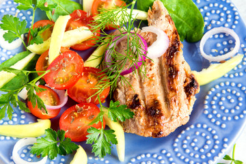 Grilled meat with vegetable salad