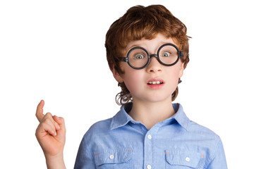 Portrait of handsome boy in round glasses who just has got an