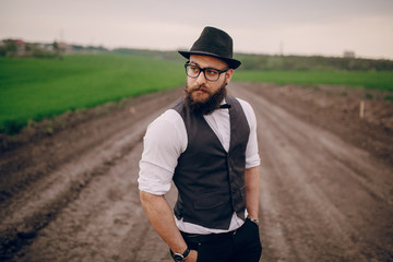 beard man in field lonley