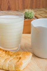 Breakfast pitcher of milk and bread
