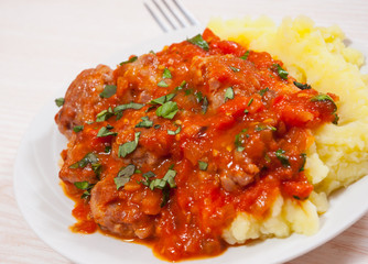 Meatballs in tomato sauce with mashed potato