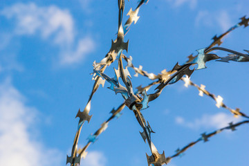 Barbed wire against the sky