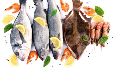 Fresh fishes and shrimps with spices  isolated on white