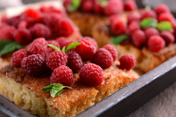 Fresh pie with raspberry in tray, closeup