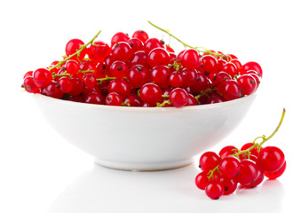 Fresh red currants in bowl isolated on white