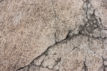 Cement floors are old and dirty.