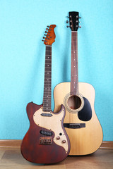 Naklejka premium Guitars on blue wallpaper background