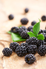 Handful blackberries on a stone surface