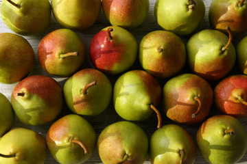 Heap of fresh ripe pears close up