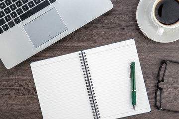 Laptop, notebook and coffee cup on work desk