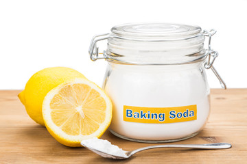 Spoonful of baking soda and lemon fruits for multiple holistic u