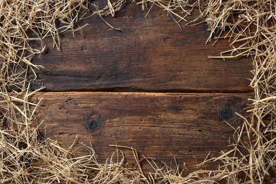 Frame from straw on vintage wooden board