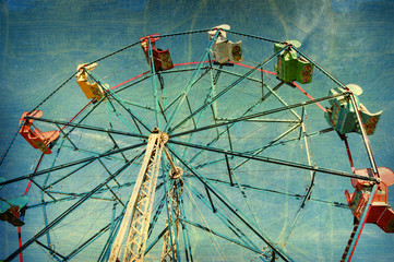aged and worn vintage photo of ferris wheel © jdoms